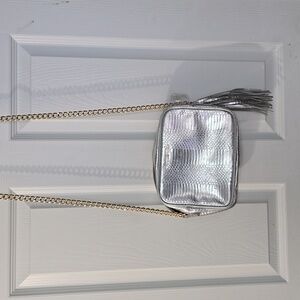 Victoria's Secret Silver crossbody purse with gold chain strap and‎ tassel